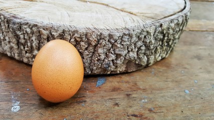 raw egg on wooden floor,egg on wooden background