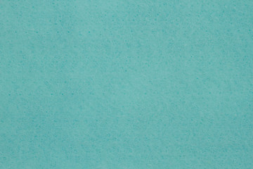 Pale teal textured felt fabric material background