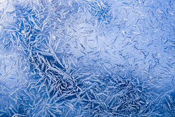 Beautiful natural frosty pattern on winter window.