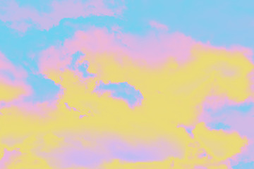 A soft cloud background with a pastel colored pink to blue.