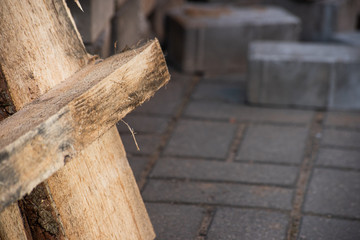 Industrial pallet on the background of a pile of paving stones