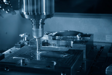 The CNC milling machine rough cutting the mould parts with the indexable radius endmill tools. The...