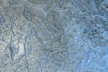 Frozen ice pattern on glass winter day