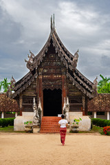 Young grils traveling Wat Ton Kain, Old temple made from wood know as landmark of city located in Chiang Mai Thailand.