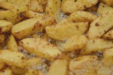 Potatoes with natural seasonings are fried in sunflower oil