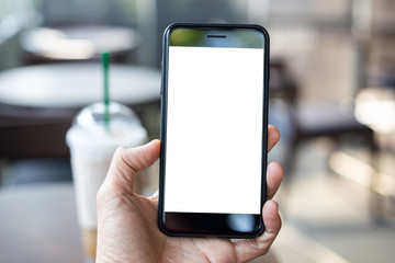 man hand using smartphone In the coffee shop,Screen blank