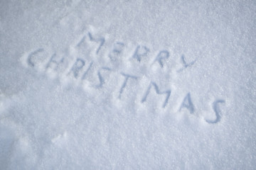 text merry christmas on snow winter day