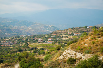 Fototapeta premium Beautiful view of the mountains and houses on a sunny day