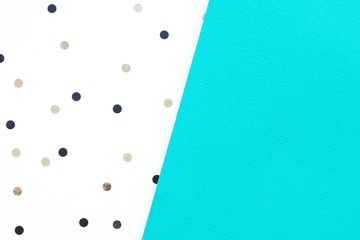 Abstract blue and white paper background with black and brown polka dots...