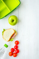 healthy food in lunchbox for dinner at school white table background top view mockup