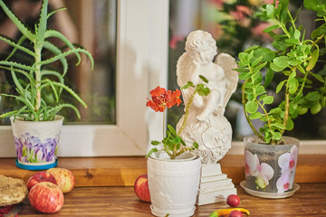 sculpture of an angel , flowers and fruits