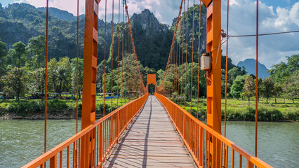 Hiking on the famous bridge in Laos