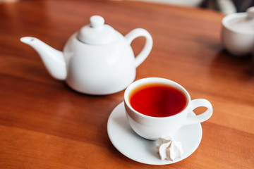 Hot tea in white cup