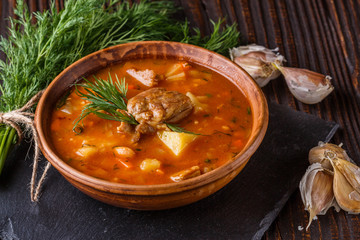Chanahi a traditional Georgian meat stew in a bowl on stoyn board