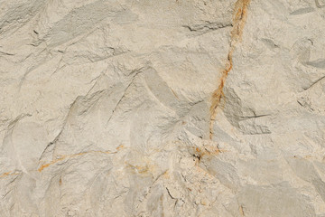 Texture of different layers of clay underground in a clay quarry. clay wall background close up