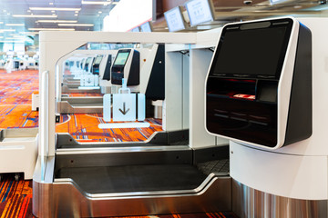 Self-service check-in and drop-off machines can print Boarding pass, manage booking in the international airport Provide service to passengers increase the speed of service in transportation concept.