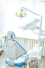 Vertical view of a dentist room with blue seat