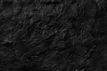 Seamless black rough concrete wall texture background.  dark cement wall.  grey plaster texture. blank for the designer