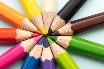 Top view of colourful crayons or colour pencil set in range isolated on pastel indigo blue background.Education,Business office and Arts Concept.Copy space empty blank for text.Back to school