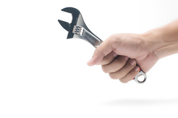 Wrench, spanner. Hand holding a metal wrench on white background