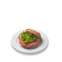 Burger with prasuto with a yeast-free bun. Healthy food.