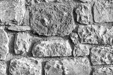 black and white ancient wall backgroung ,texture of rough stone ,old gray abstraction