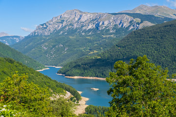 Fototapeta na wymiar Piva Lake (Pivsko Jezero) and Pluzine town view in Montenegro.