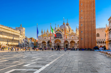 View of Basilica di San Marco and on piazza San Marco in Venice, Italy. Architecture and landmark of Venice. Sunrise cityscape of Venice. - obrazy, fototapety, plakaty