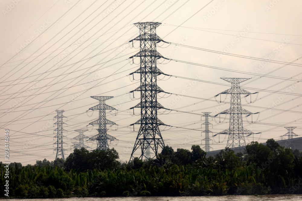 Wall mural massive towers carrying high tension and high voltage power lines in rural vietnam