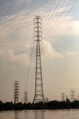 massive towers carrying high tension and high voltage power lines in rural Vietnam