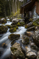 Creek Flowing by Ancient Wooden Mill near Gollinger Waterfall