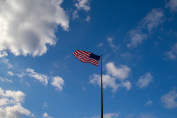 United States flag isolated on the blue sky 