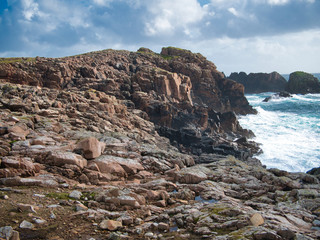 Coastal debris among eroded rocks, near Culswick on Mainland, Shetland, UK