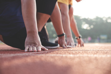 Sports background. Runner feet running on road closeup on shoe. Start line