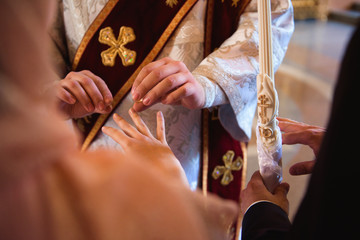 Obraz premium Russian church. Bride and groom in the church during the Christian wedding ceremony.
