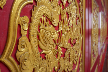 Hand crafted dragon on a wooden door