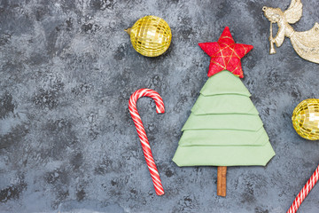 Christmas tree made from napkin with red star.
