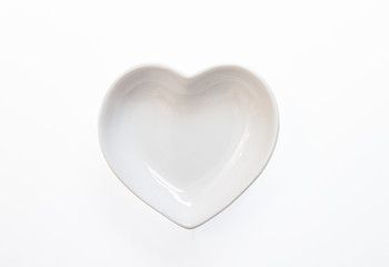 Empty ceramic round plate heard isolated