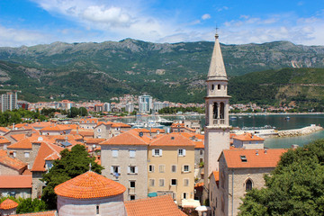 Budva Old town in Montenegro. View of St. John's Church and mountains