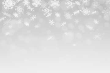 Fototapeta na wymiar Snowflakes and snowfall on a cold blue winter background christmas