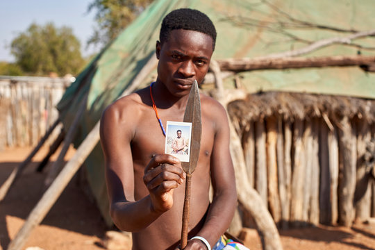 Mudimba tribe man showing picture of himself