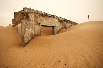 Abandoned colonial Portuguese house in sand dune