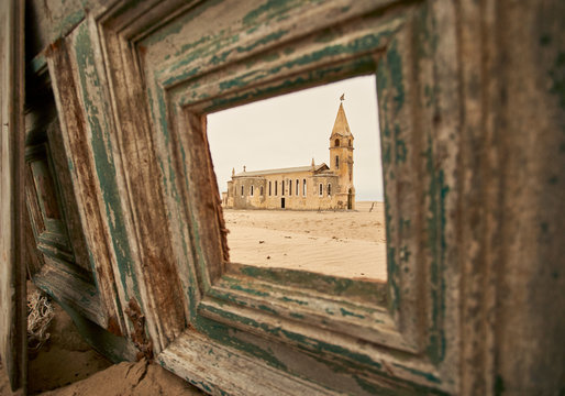 View through a window of the church at the abandoned village of Ilha dos Tigres, Angola.