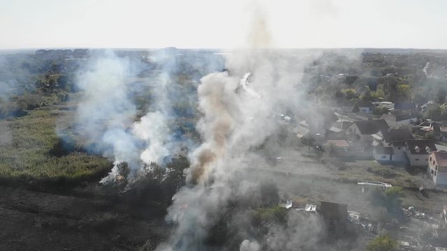 Fire truck in action Pollution Smoke Fire suburb aerial view slow motion
