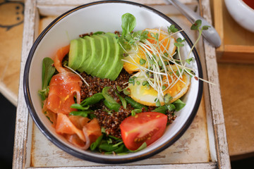 Quinoa salad in bowl with avocado,tomatoes and eggs