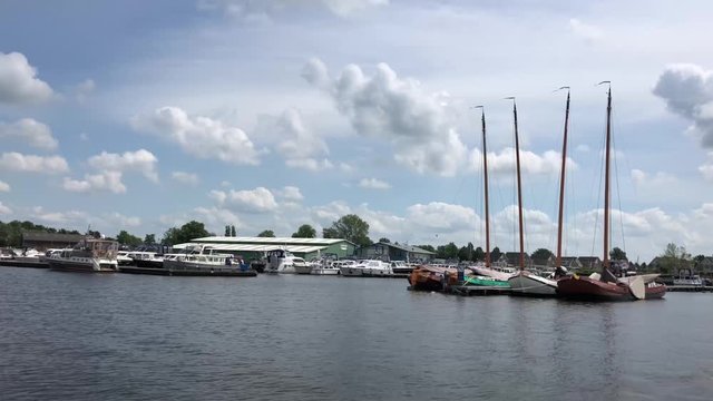 Leaving the harbor of Terherne, Friesland The Netherlands