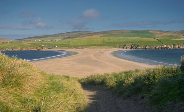 The sand spit, or tombolo, that joins St Ninian's Isle to Mainland Shetland - taken from the island looking accross to the farmland of south Mainland.