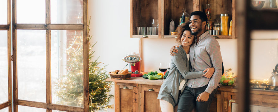 Young loving couple having good time at christmas morning