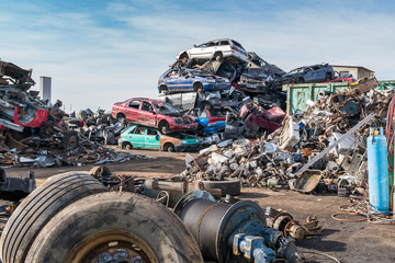 Old cars in landfill. Garbage pile in trash dump or landfill. Po