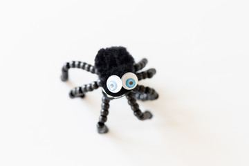 Cute children homemade spider art project with black beads and pom pom